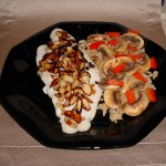 Swai Almondine with brown rice topped with sauteed mushrooms and red pepper strips